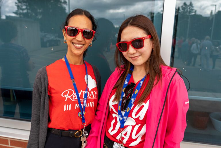 Photo: WRHN @ Queen's Blvd staff members wearing their RedDAY merch.