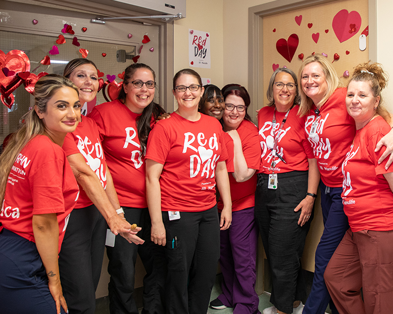 WRHN staff wearing their RedDAY t-shirts with RedDAY decorations on the walls and doors of the hospital.